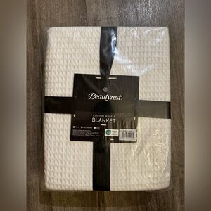 Brand new Beautyrest Cotton Waffle Blanket in a classic white color.